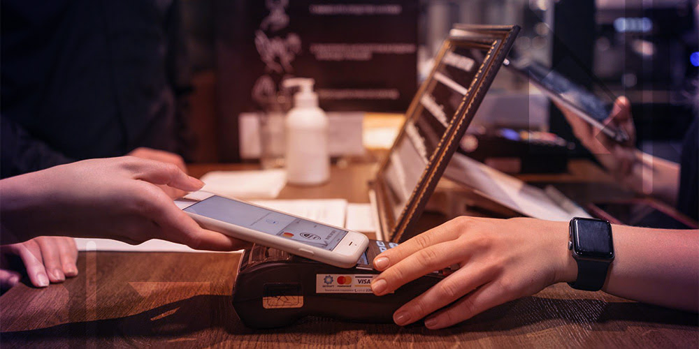 Person using smartphone for contactless payment